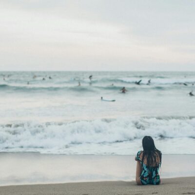 Woman Sitting at Shore